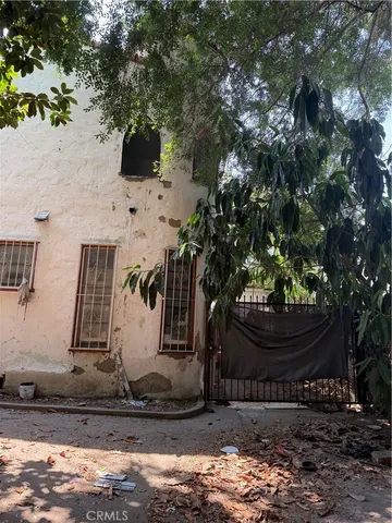 a view of house with yard