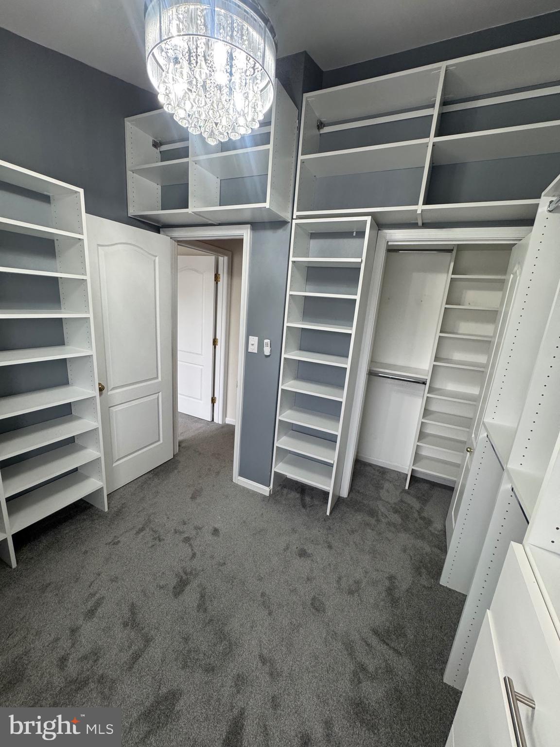 7705 Periwinkle Way, Unit 71 Severn, MD 21144 - Photo 27 of 28 a view of closet area with stairs