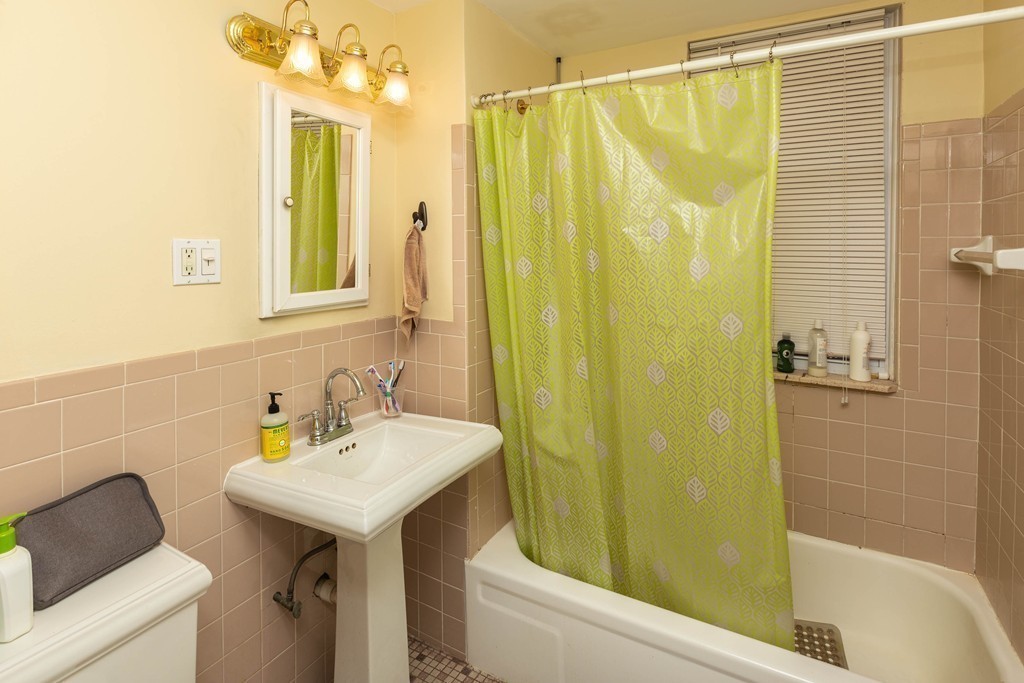 116 Sutherland Road, Unit 2 Boston, MA 02135 - Photo 9 of 10 a bathroom with a sink and a mirror