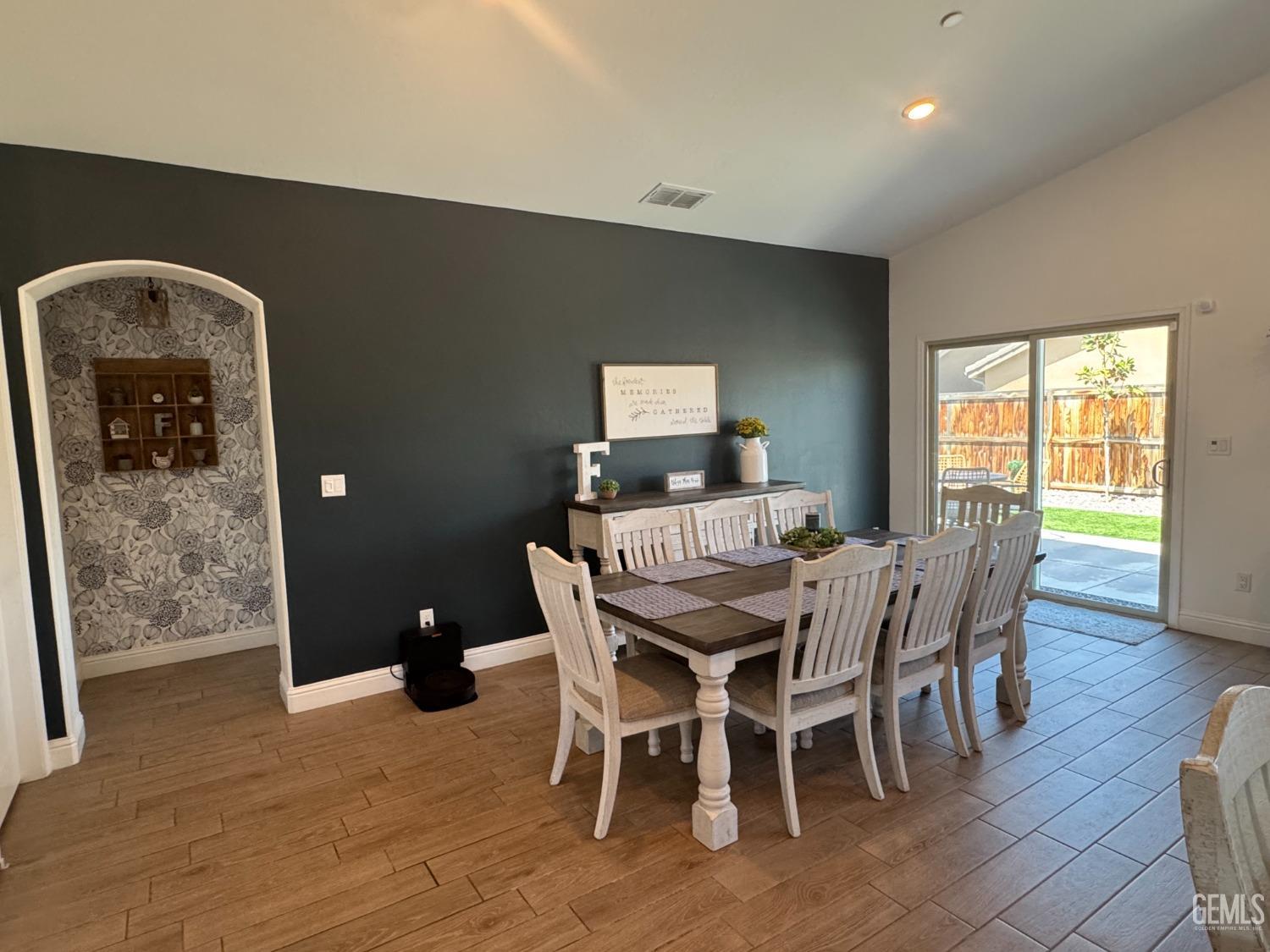 Undisclosed Address Shafter, CA 93263 - Photo 17 of 46 a view of a dining room with furniture window and wooden floor