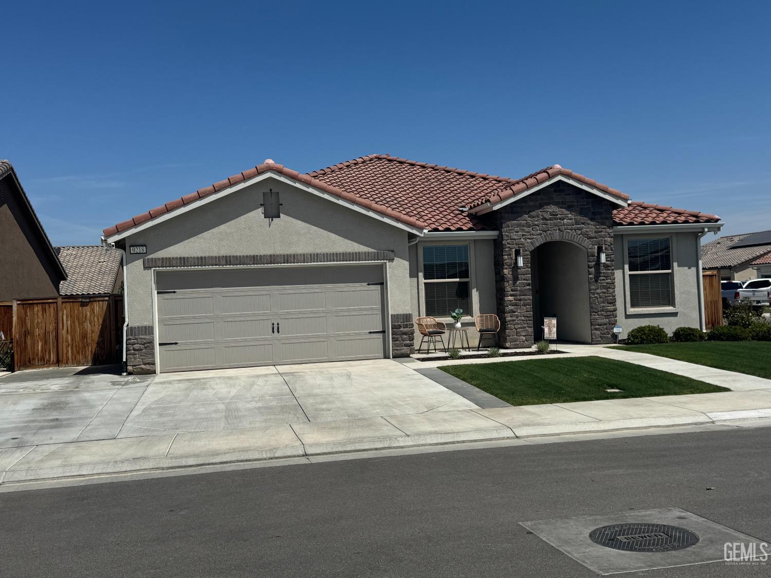 Undisclosed Address Shafter, CA 93263 - Photo 2 of 46 a front view of a house with yard