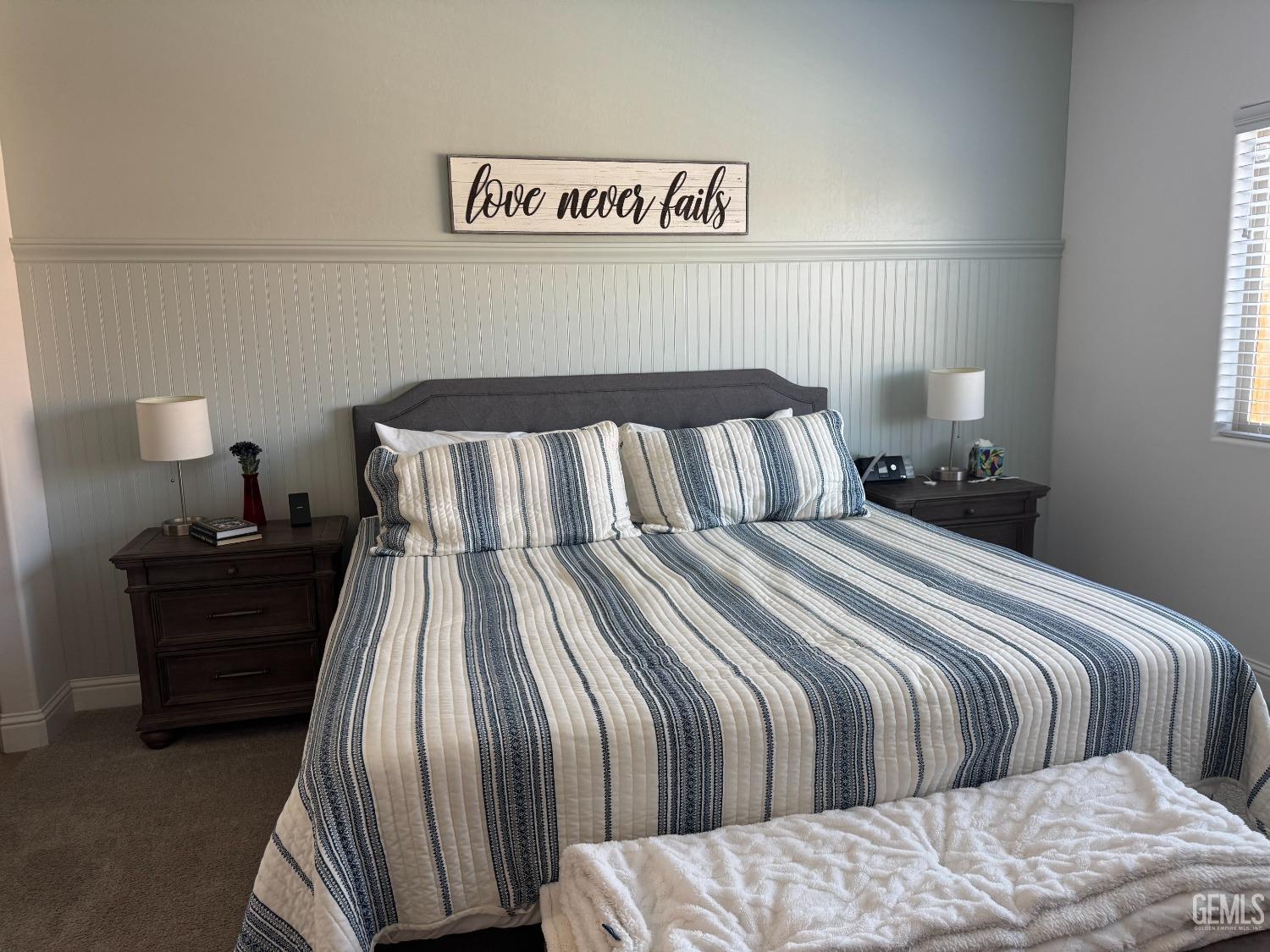 Undisclosed Address Shafter, CA 93263 - Photo 21 of 46 a bedroom with a bed and a night stand