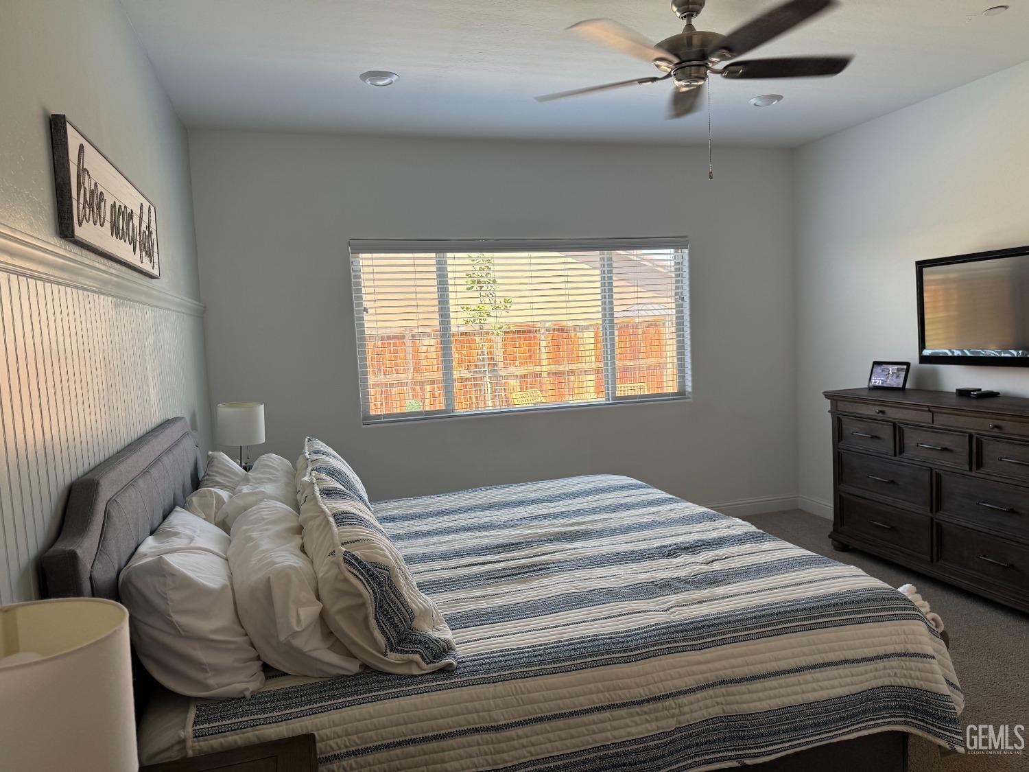 Undisclosed Address Shafter, CA 93263 - Photo 22 of 46 a bedroom with a bed and a tv