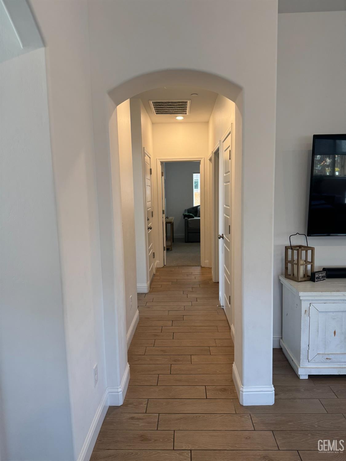 Undisclosed Address Shafter, CA 93263 - Photo 26 of 46 a view of a hallway with wooden floor and closet