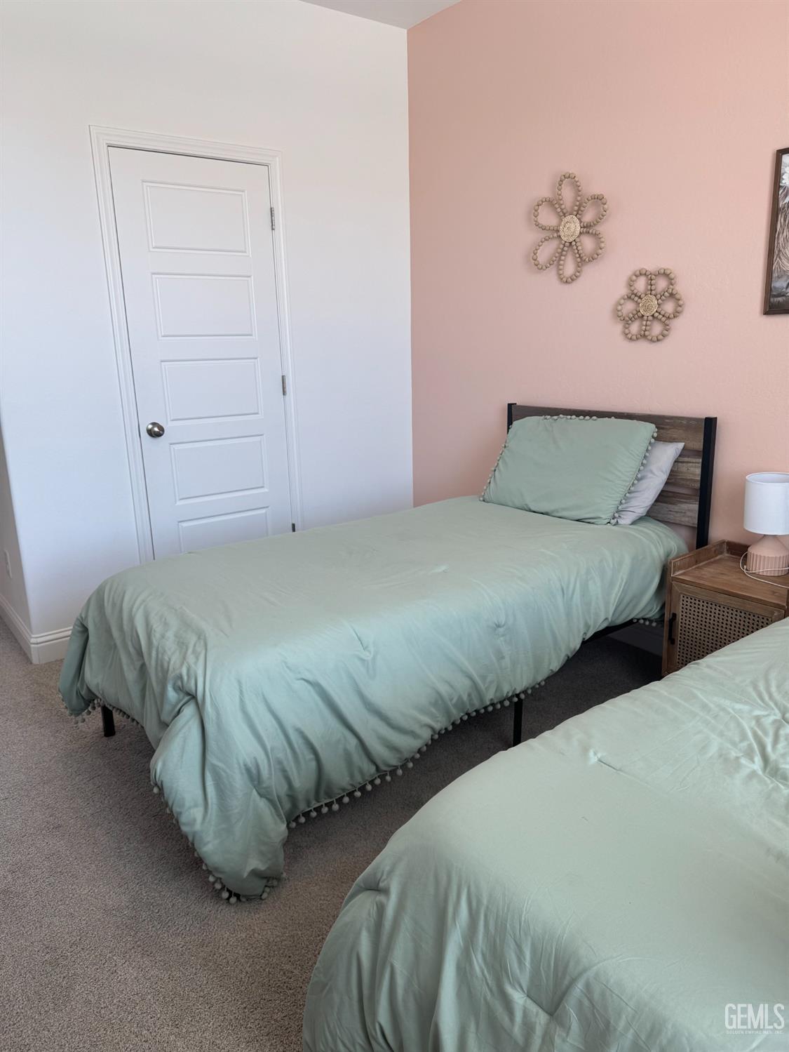 Undisclosed Address Shafter, CA 93263 - Photo 29 of 46 a bedroom with two beds and a painting on the wall