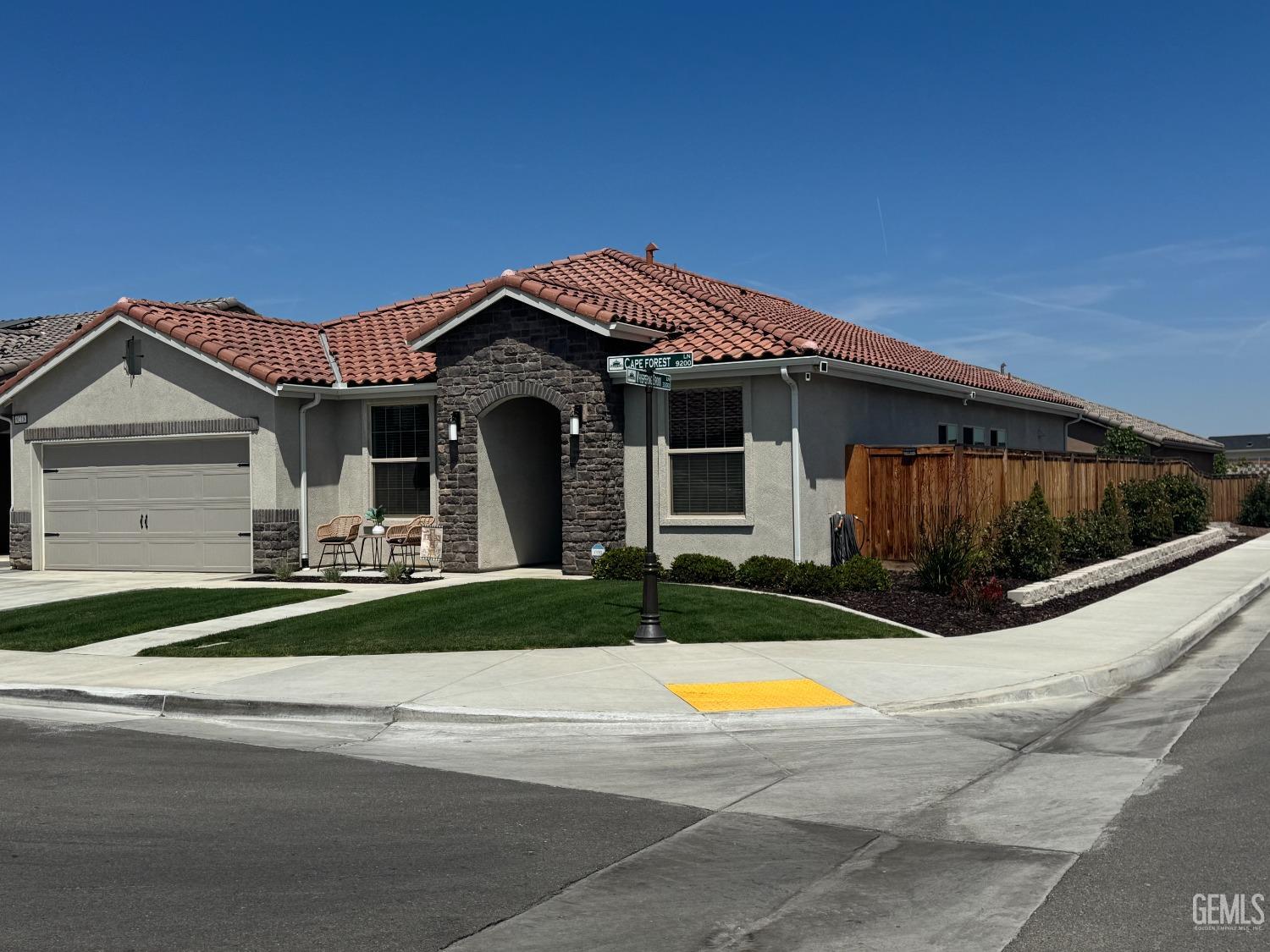 Undisclosed Address Shafter, CA 93263 - Photo 3 of 46 a view of a white house with a big yard and large trees