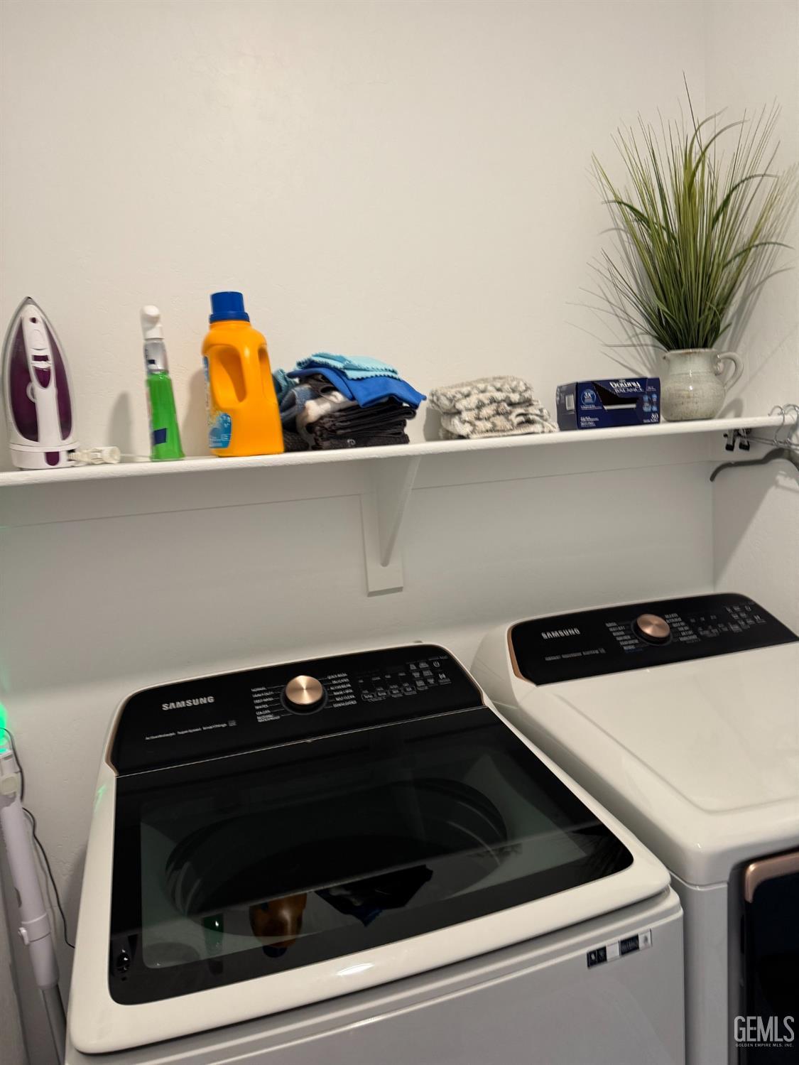 Undisclosed Address Shafter, CA 93263 - Photo 31 of 46 a close view of a stove a microwave and a counter space