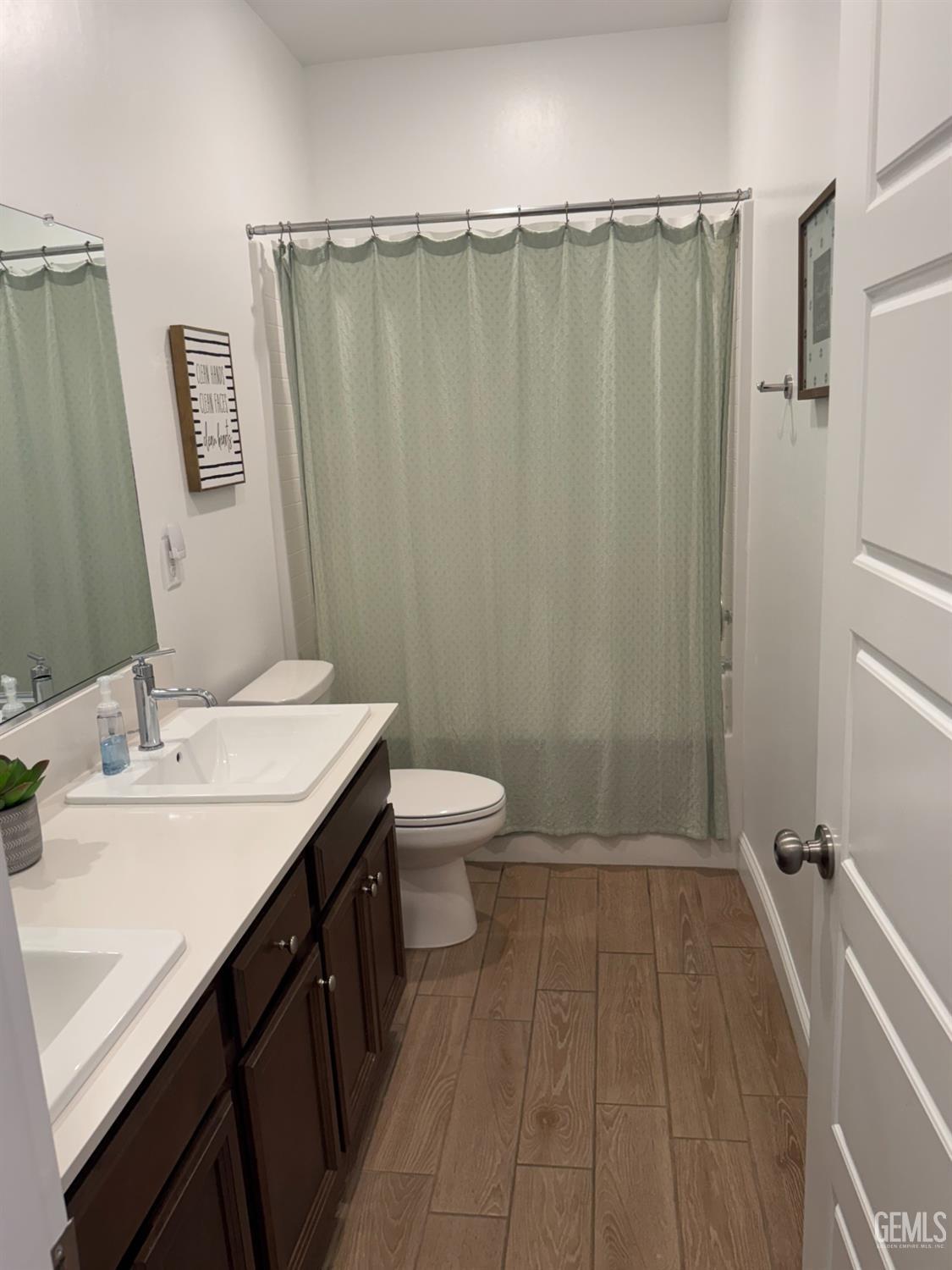 Undisclosed Address Shafter, CA 93263 - Photo 32 of 46 a bathroom with a sink a toilet a mirror and shower