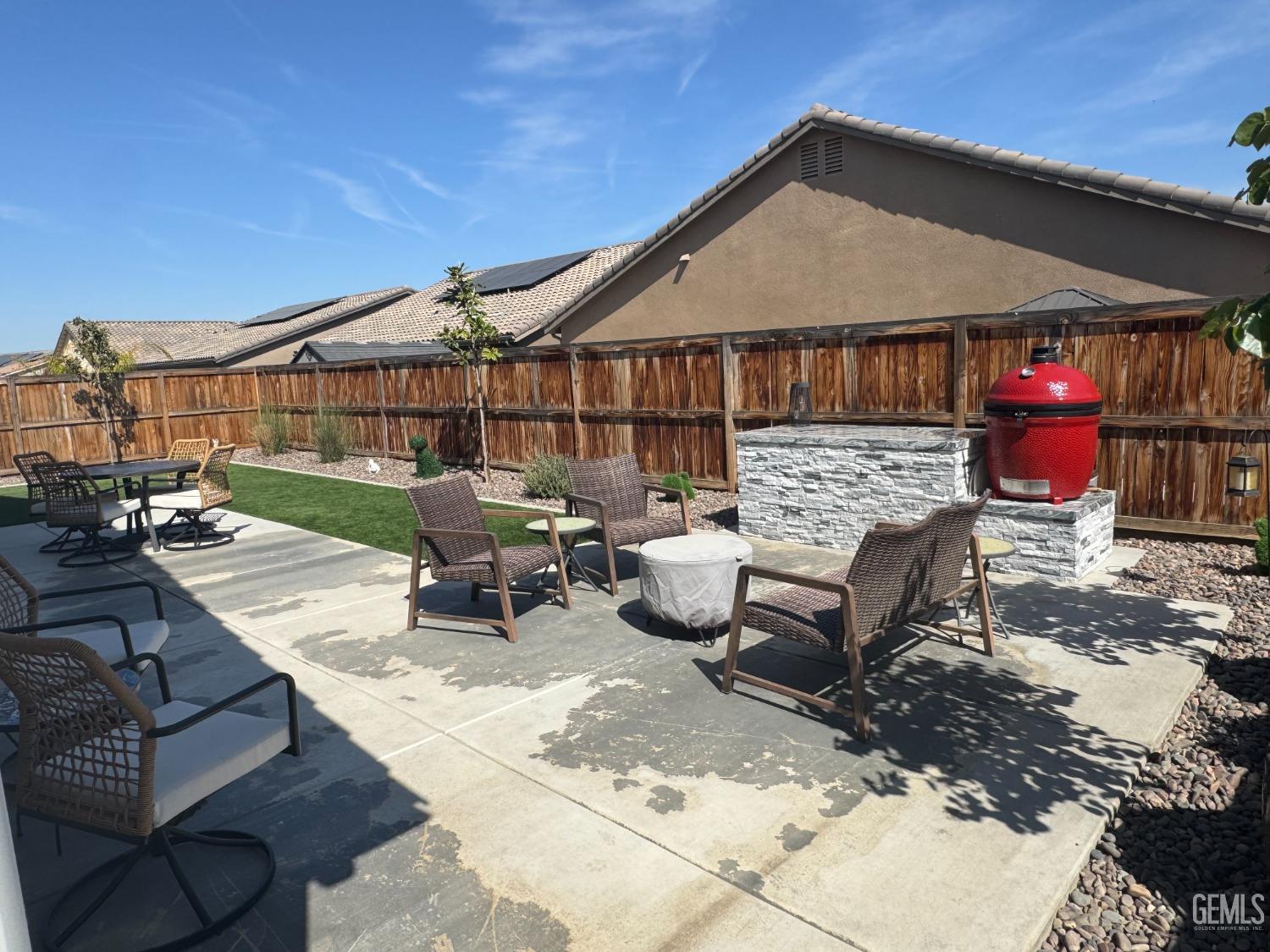 Undisclosed Address Shafter, CA 93263 - Photo 39 of 46 a roof deck with table and chairs under an umbrella
