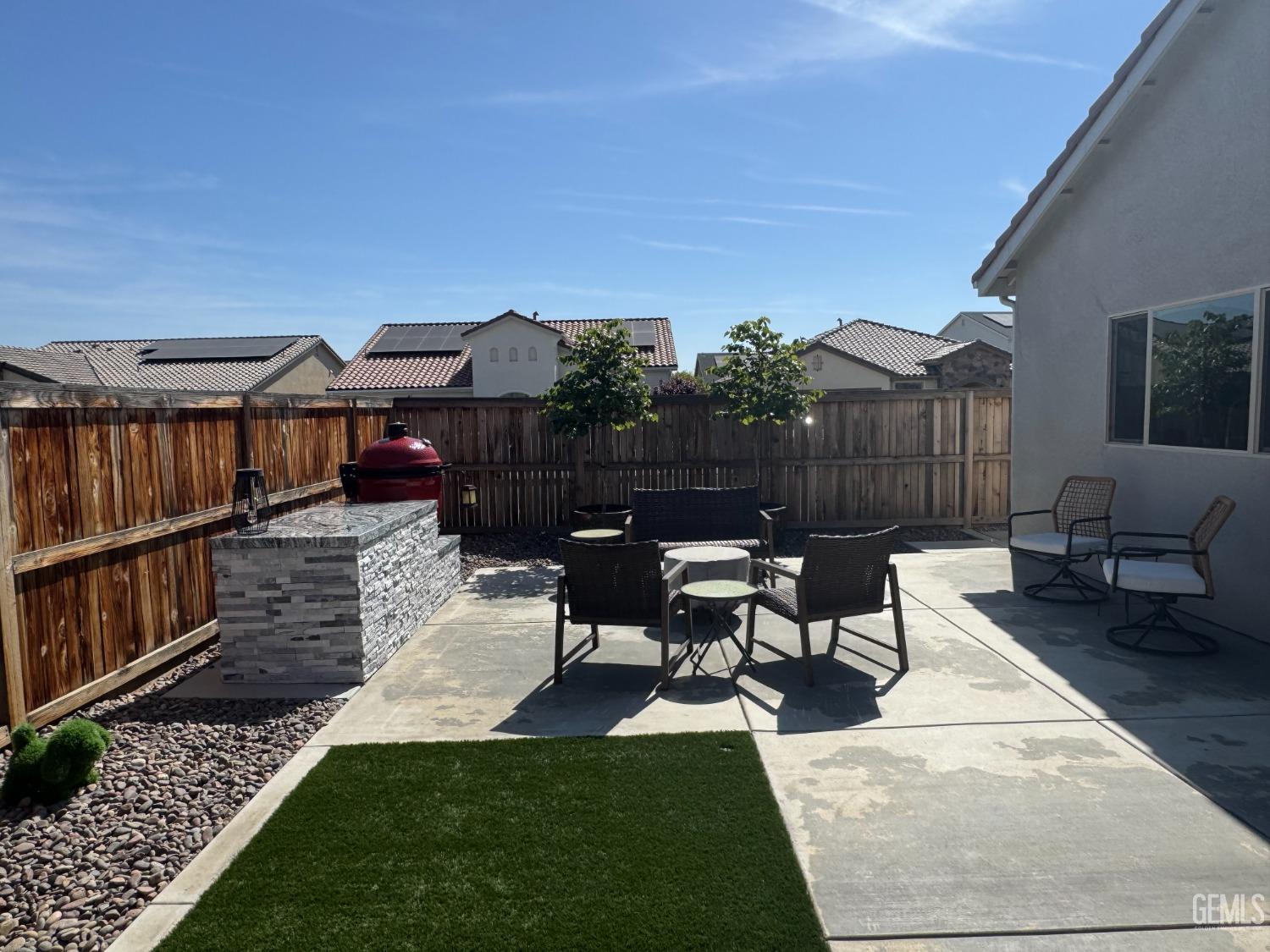 Undisclosed Address Shafter, CA 93263 - Photo 40 of 46 a view of a patio with table and chairs with wooden floor and fence