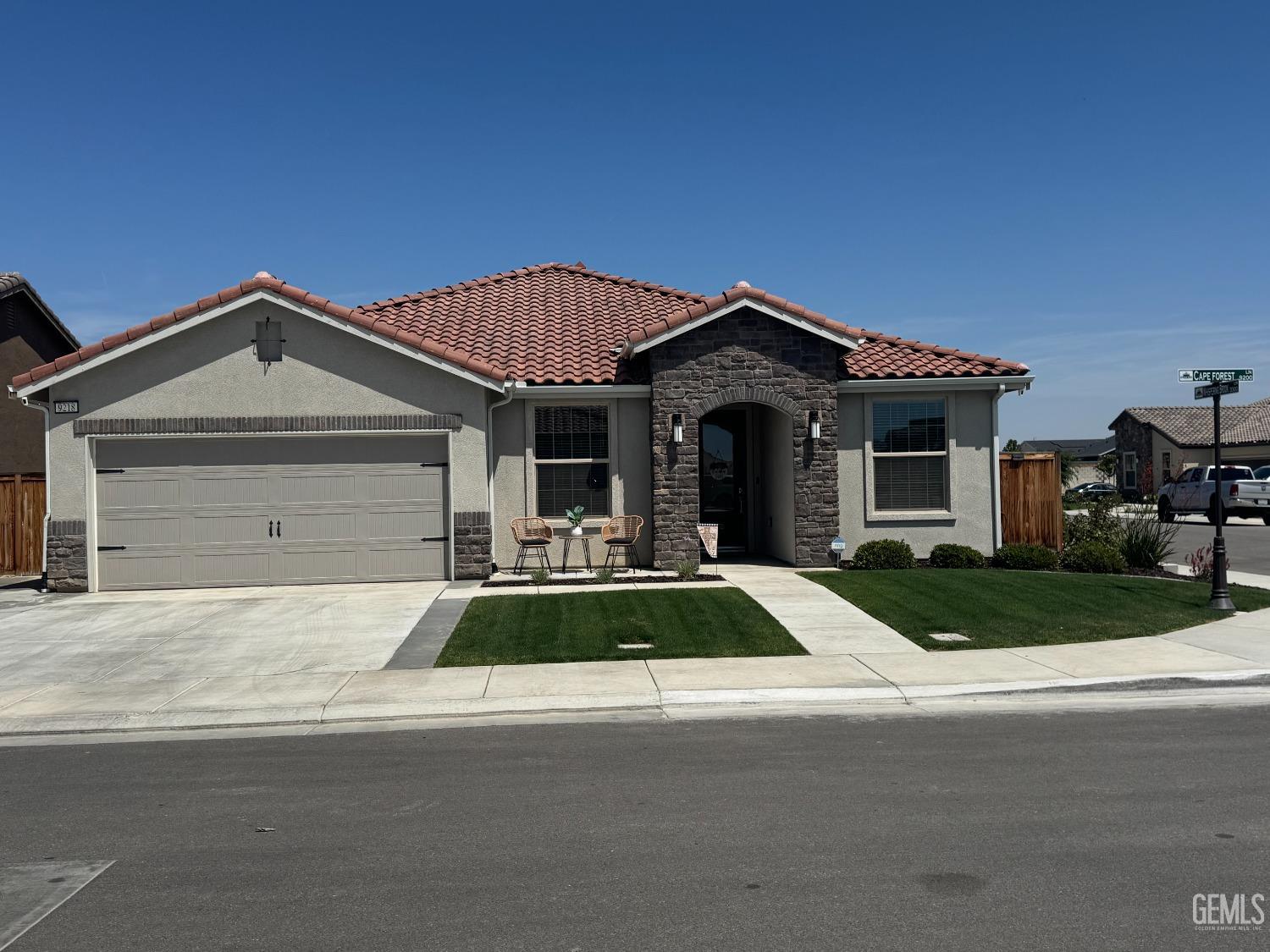 Undisclosed Address Shafter, CA 93263 - Photo 46 of 46 a front view of a house with yard porch and outdoor seating