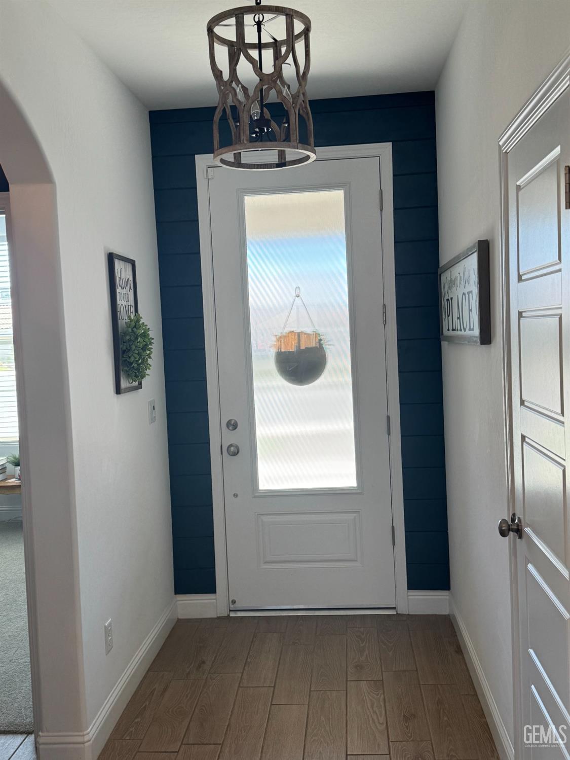 Undisclosed Address Shafter, CA 93263 - Photo 5 of 46 a view of a hallway with a dining room