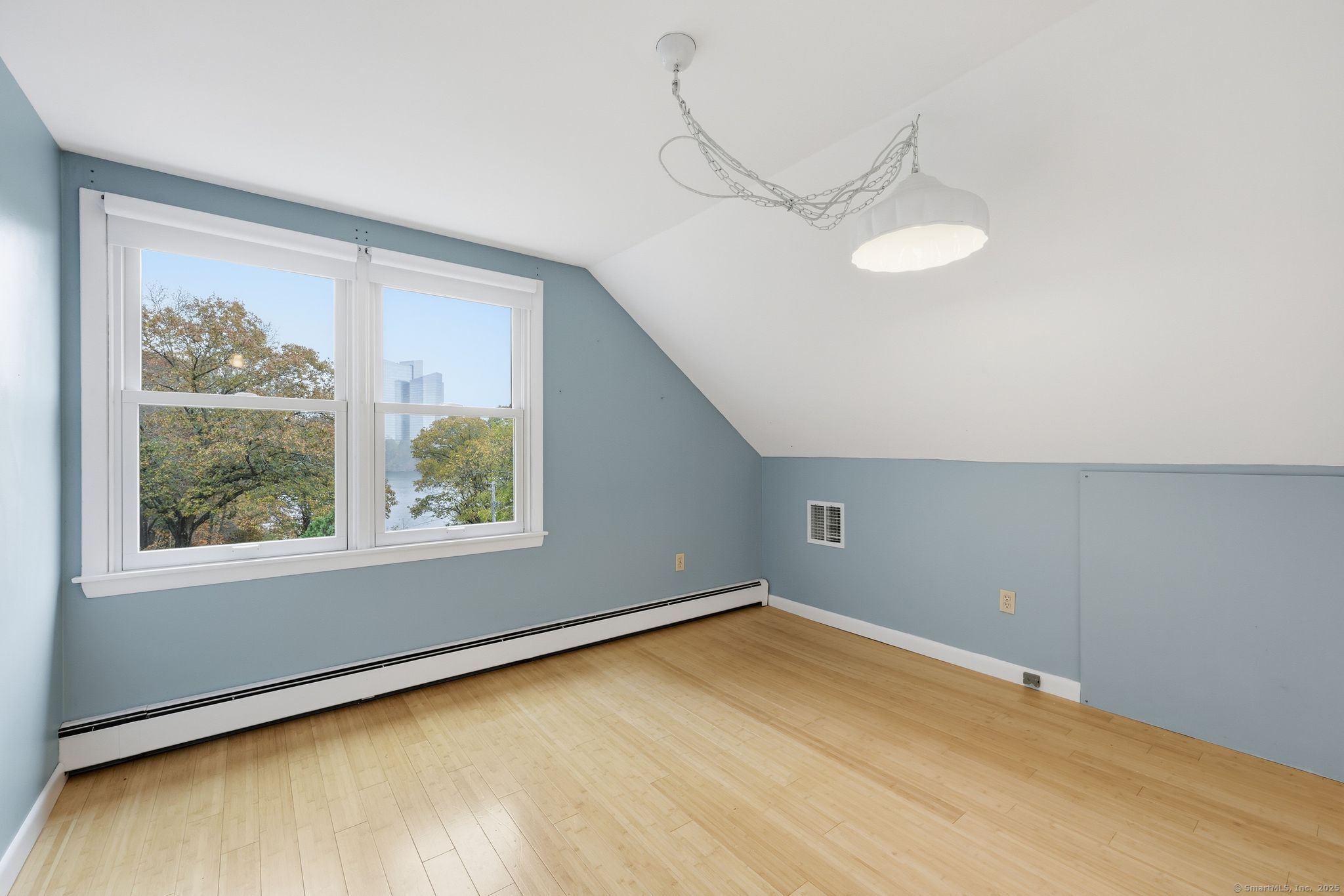 102 Lucas Park Road Norwich, CT 06360 - Photo 16 of 37 a view of a room with wooden floor and windows