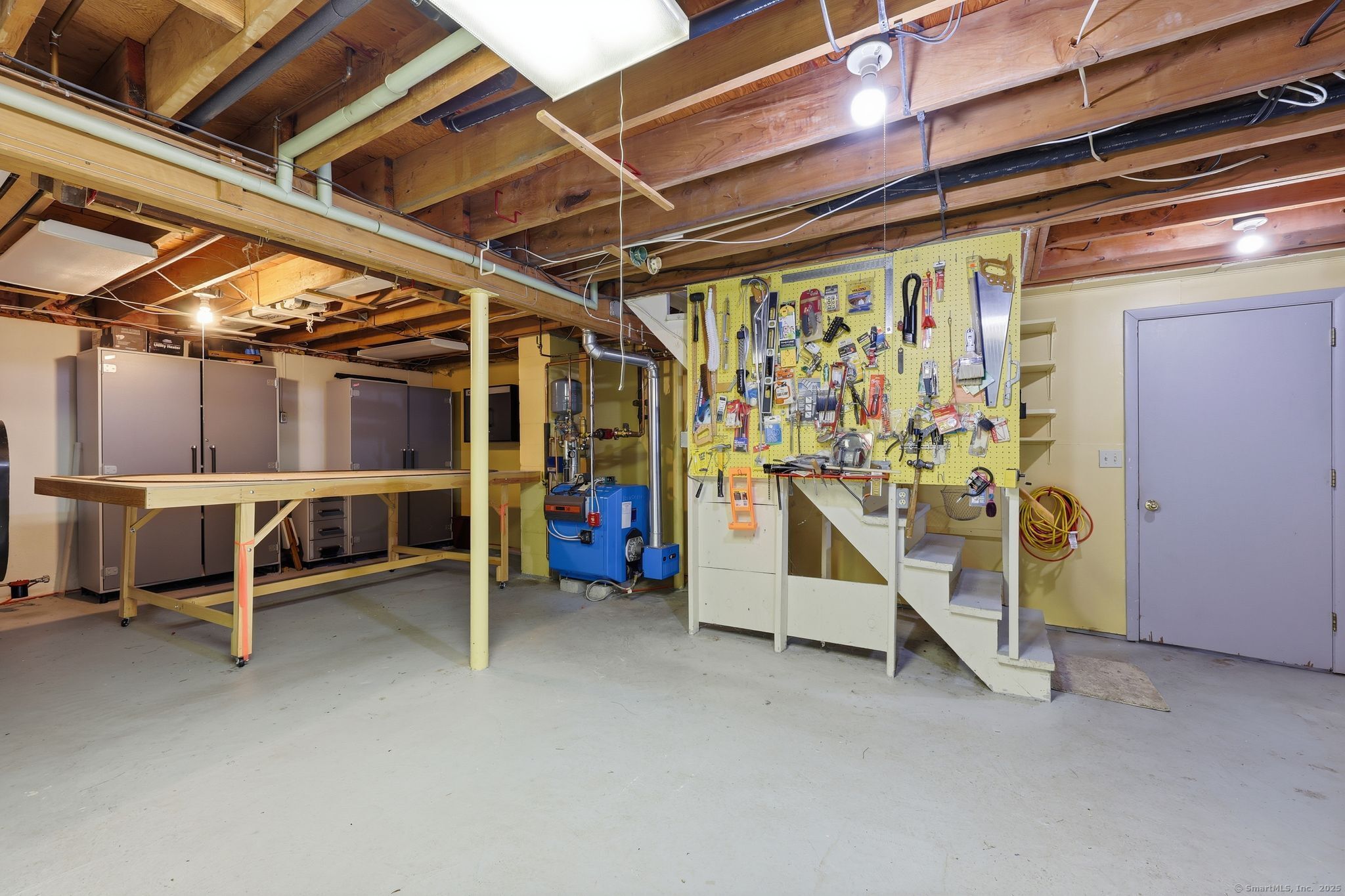 102 Lucas Park Road Norwich, CT 06360 - Photo 19 of 37 a view of a room with wooden shelves
