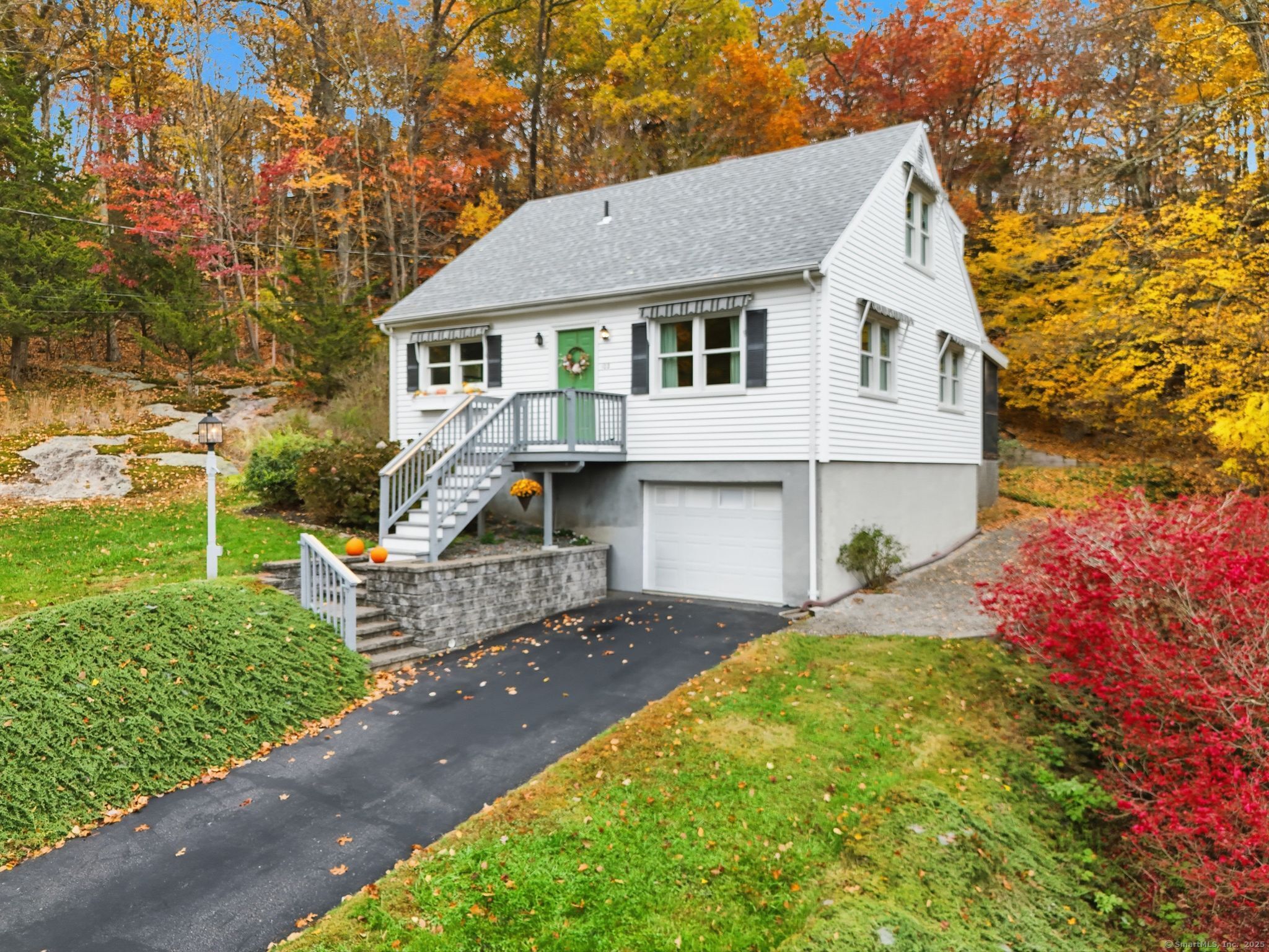 102 Lucas Park Road Norwich, CT 06360 - Photo 29 of 37 a front view of a house with a garden and yard