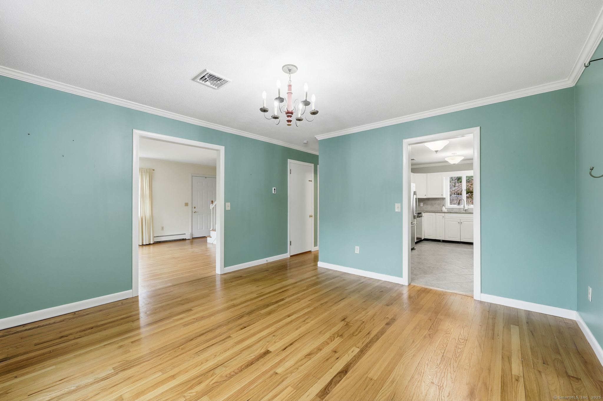 102 Lucas Park Road Norwich, CT 06360 - Photo 4 of 37 wooden floor in an empty room with a window