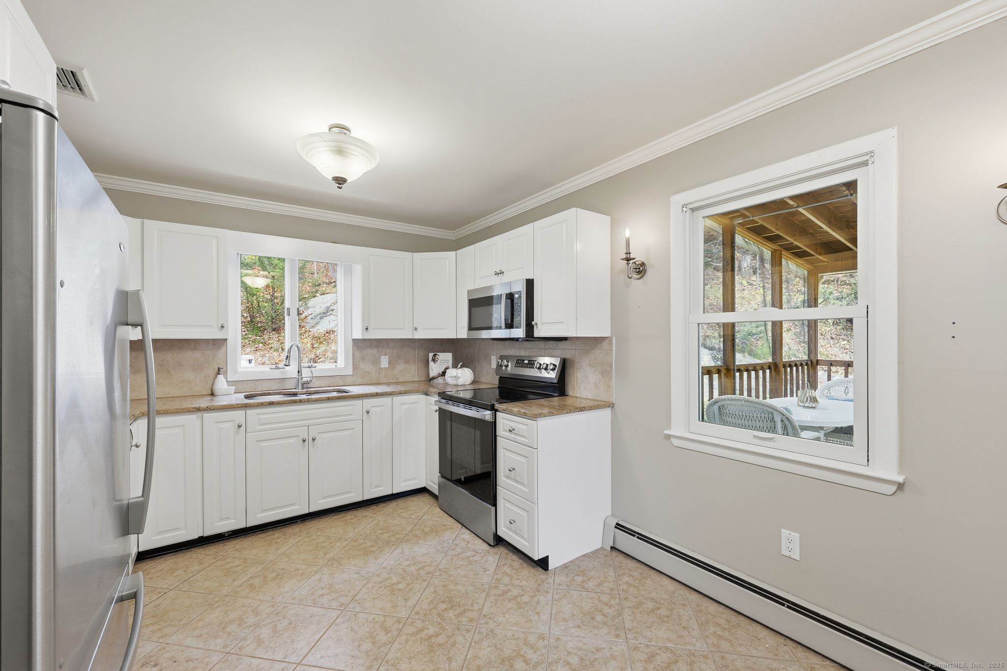 102 Lucas Park Road Norwich, CT 06360 - Photo 7 of 37 a kitchen with stainless steel appliances granite countertop a stove and a refrigerator