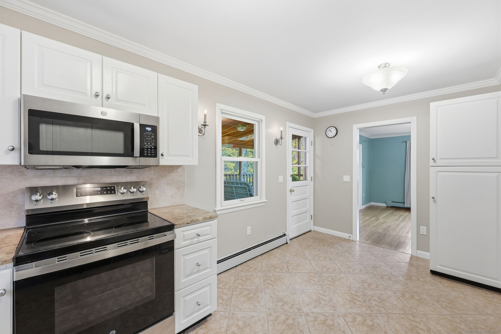 102 Lucas Park Road Norwich, CT 06360 - Photo 8 of 37 a kitchen with a stove and a microwave