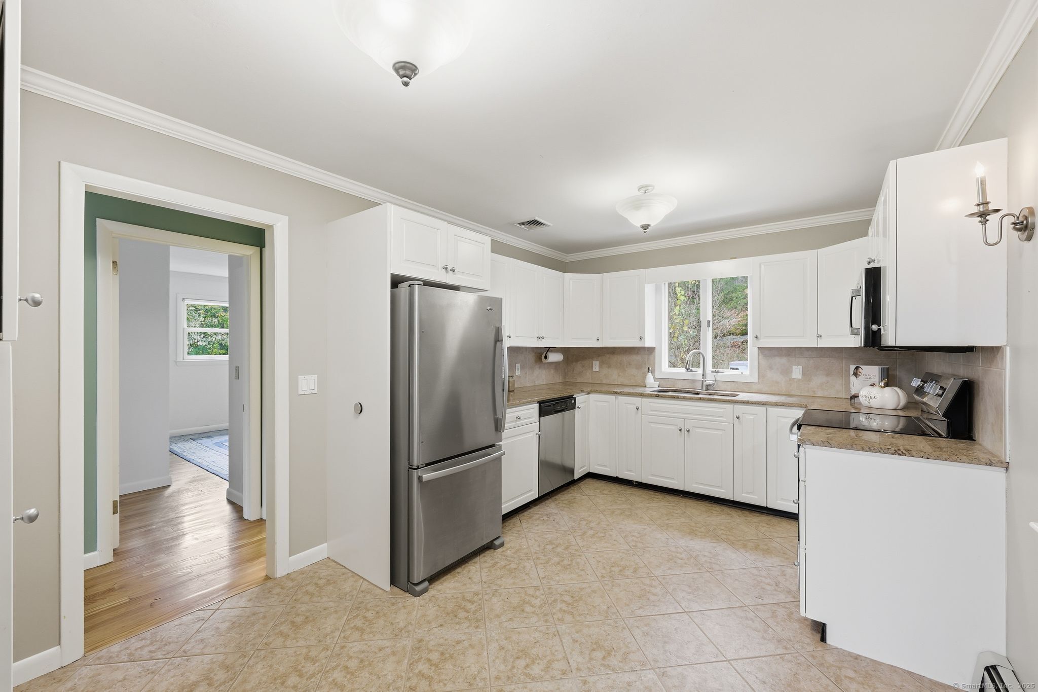 102 Lucas Park Road Norwich, CT 06360 - Photo 9 of 37 a kitchen with a refrigerator and a sink