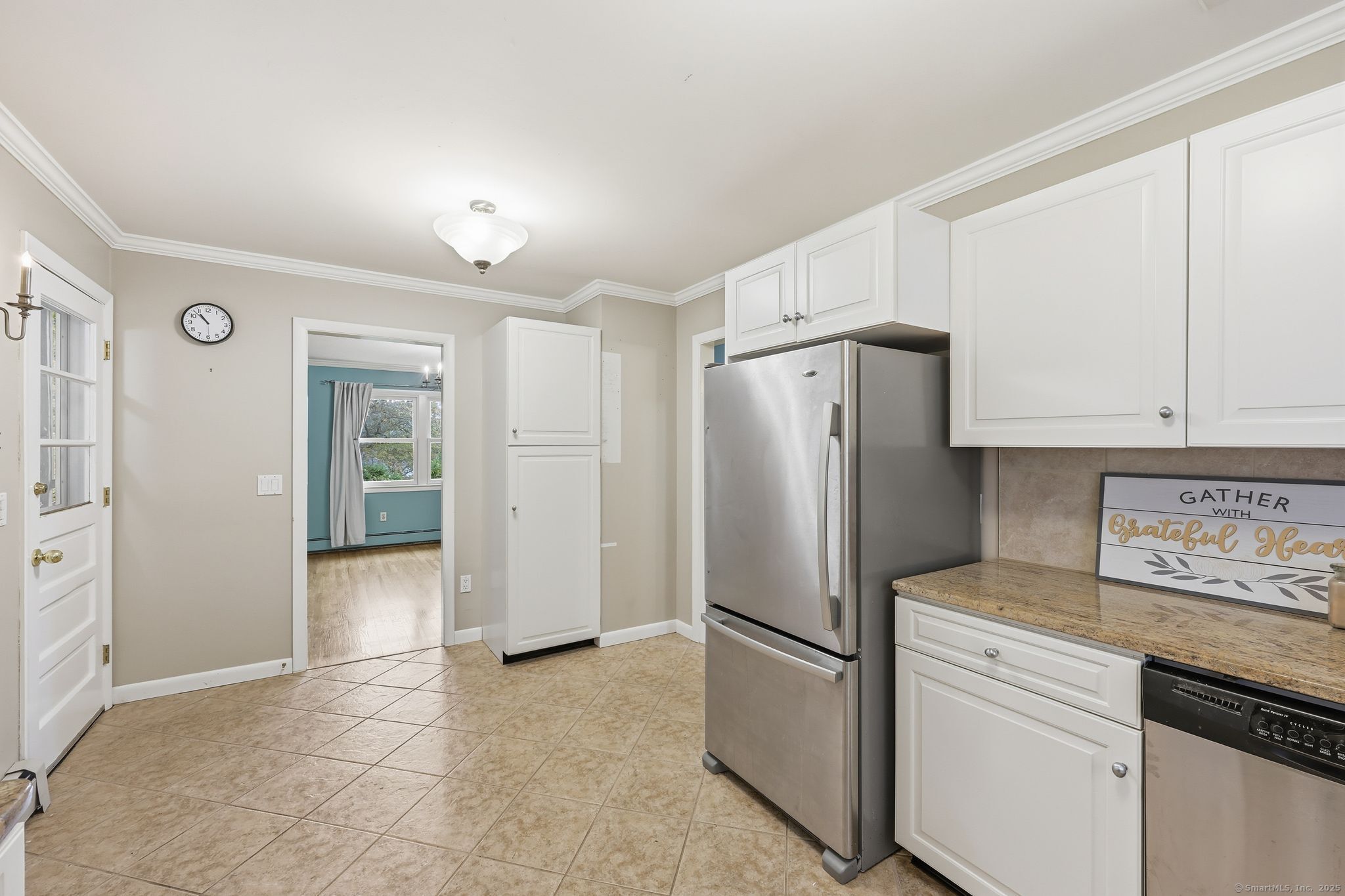 102 Lucas Park Road Norwich, CT 06360 - Photo 10 of 37 a kitchen with stainless steel appliances a refrigerator and cabinets