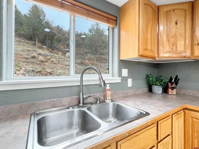 a view closeup a sink a counter top and a window