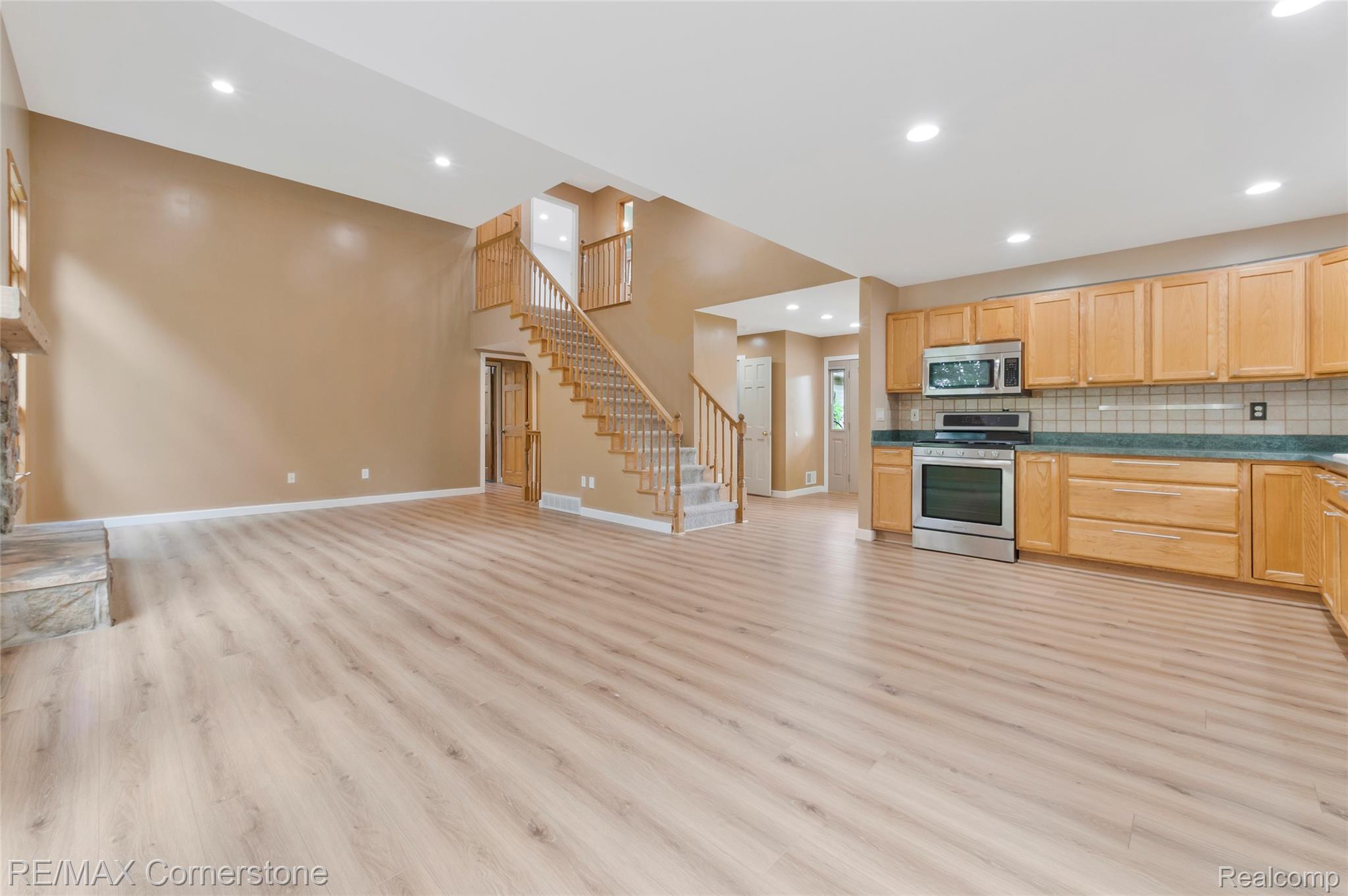 12701 Capernall Road Carleton, MI 48117 - Photo 15 of 62 Living room open to the kitchen and dining area