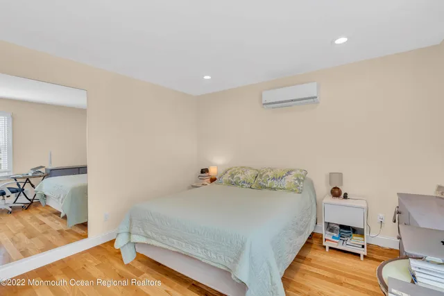 a bedroom with a bed and a table in it