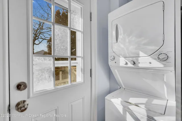 a bathroom with a toilet and a mirror