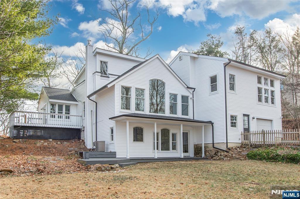 6 Berton Road Boonton, NJ 07005 - Photo 1 of 32 a view of a white house with large windows