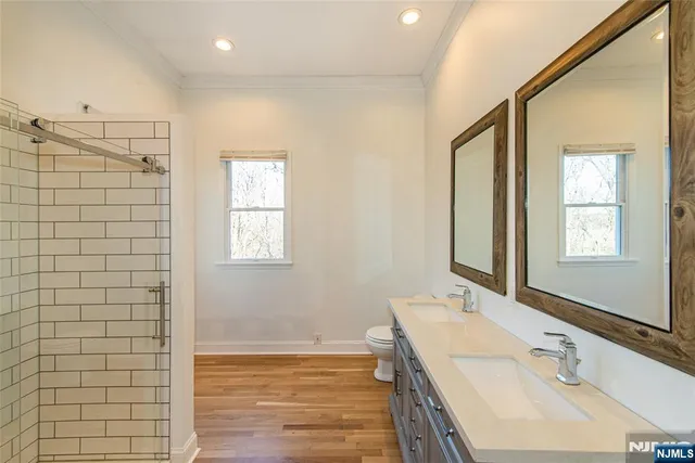 a kitchen with stainless steel appliances a refrigerator sink and cabinets