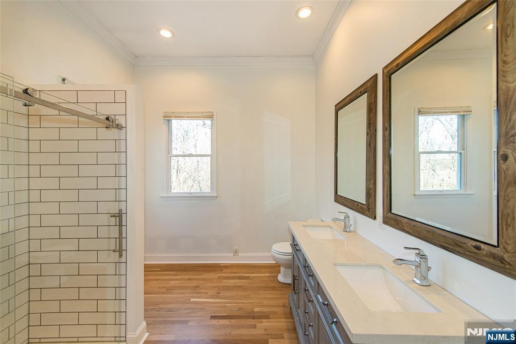 6 Berton Road Boonton, NJ 07005 - Photo 12 of 32 a bathroom with a sink and a mirror