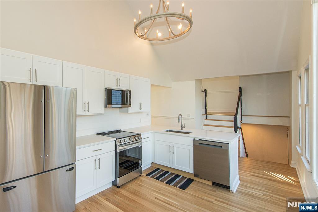 6 Berton Road Boonton, NJ 07005 - Photo 15 of 32 a kitchen with stainless steel appliances a refrigerator sink and cabinets