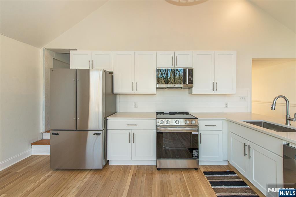 6 Berton Road Boonton, NJ 07005 - Photo 16 of 32 a kitchen with a refrigerator and a sink