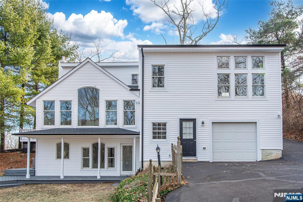 6 Berton Road Boonton, NJ 07005 - Photo 32 of 32 a front view of a house with a yard and garage