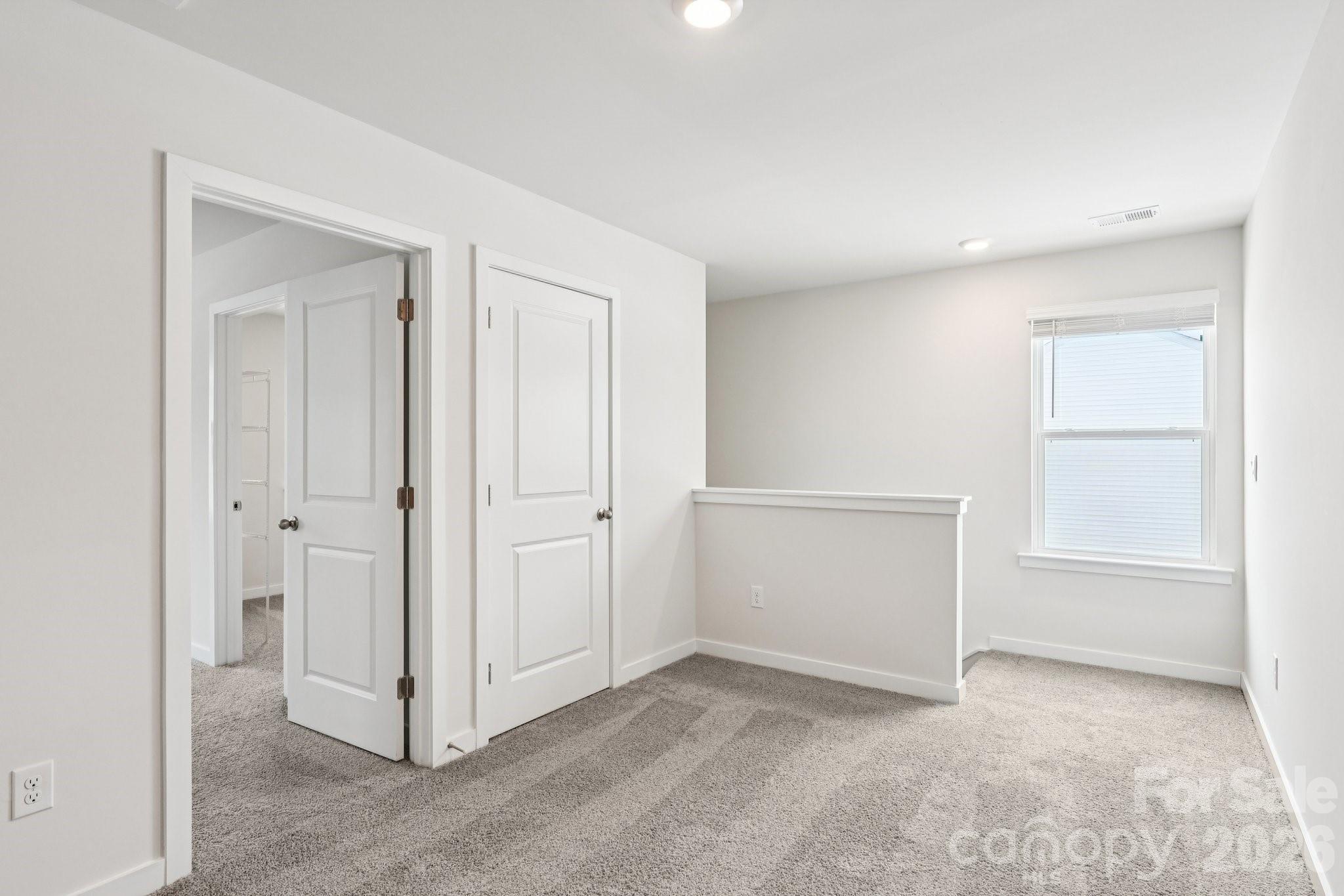 1447 Mammoth Road Hickory, NC 28602 - Photo 16 of 42 an empty room with windows and closet