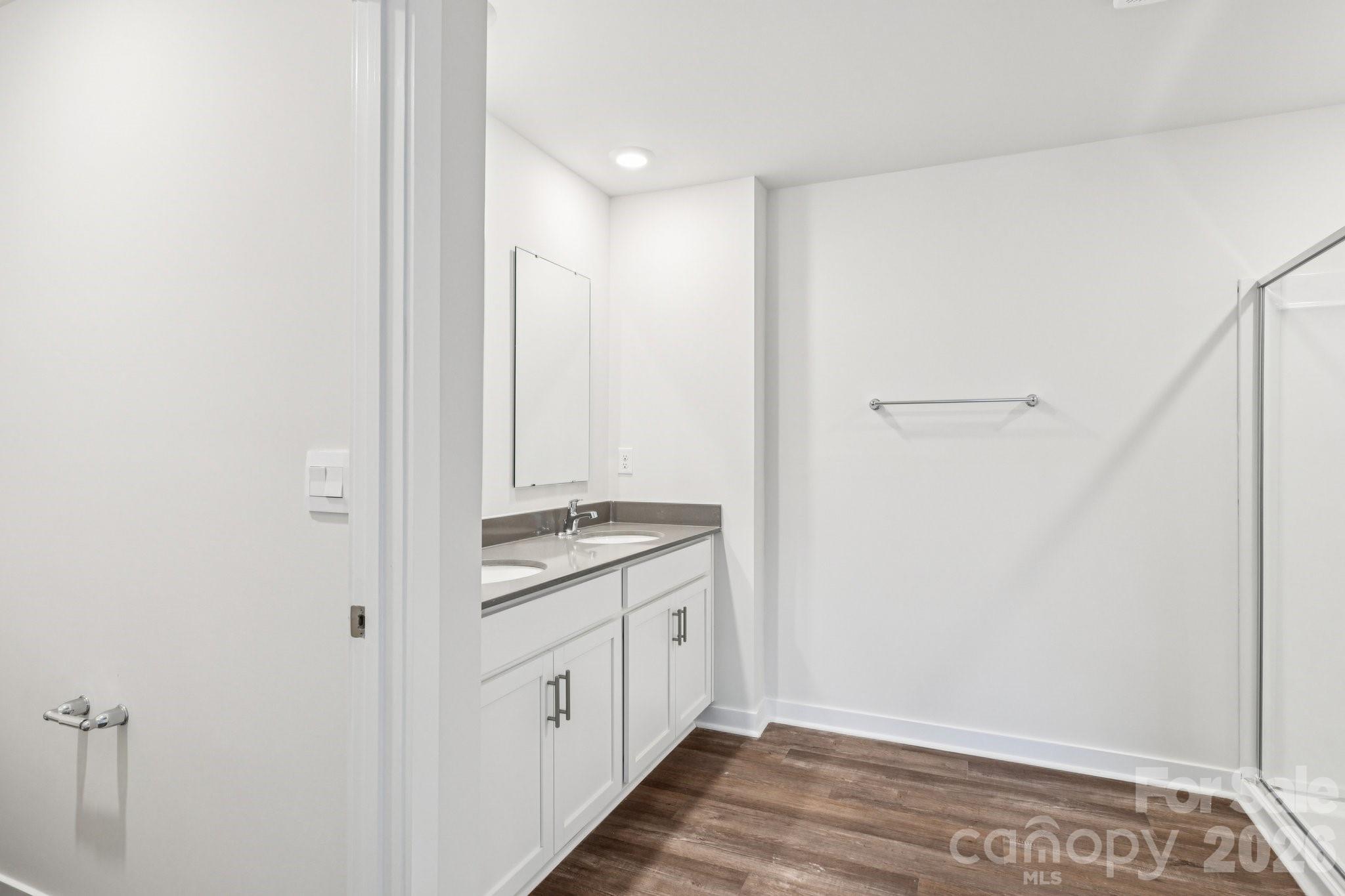 1447 Mammoth Road Hickory, NC 28602 - Photo 24 of 42 a view of a kitchen with white cabinets and wooden floor