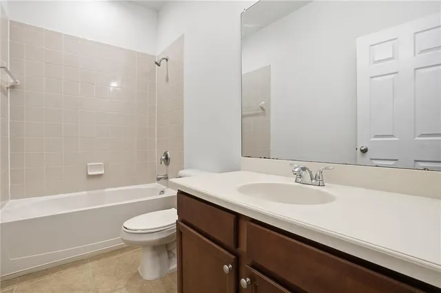 a bathroom with a sink a toilet and a bathtub