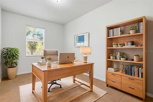 a workspace with furniture and window