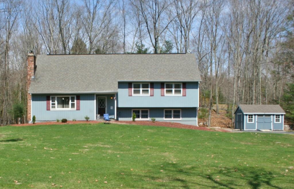 7 September Road Mansfield, CT 06268 - Photo 1 of 1 a view of house with a big yard and large trees