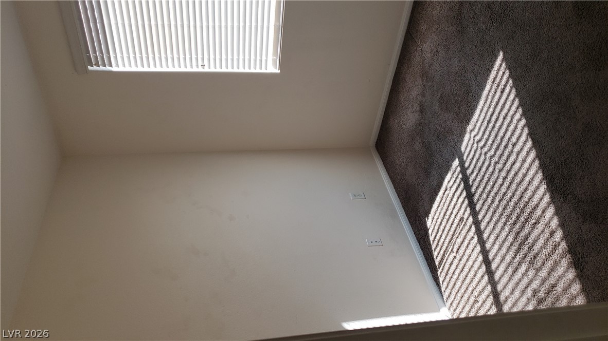 9112 Manalang Road Las Vegas, NV 89123 - Photo 20 of 50 Sunlight streams across the soft, dark carpeting in this versatile secondary bedroom.