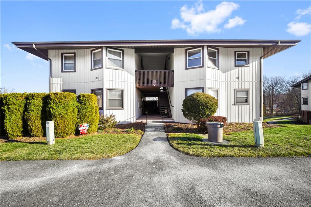 17A Hastings Court, Unit E Yorktown Heights, NY 10598 - Photo 1 of 13 a front view of a house with garden