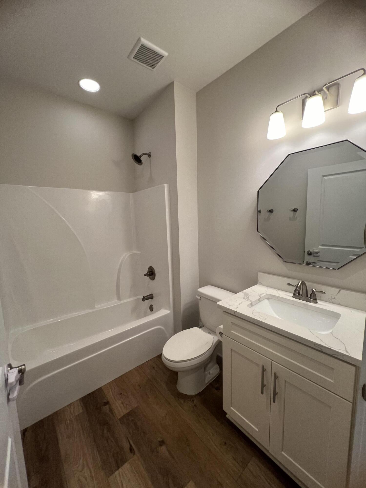 201 Marsh Landing South Freeport, FL 32439 - Photo 13 of 19 a bathroom with a double vanity sink toilet mirror and bathtub