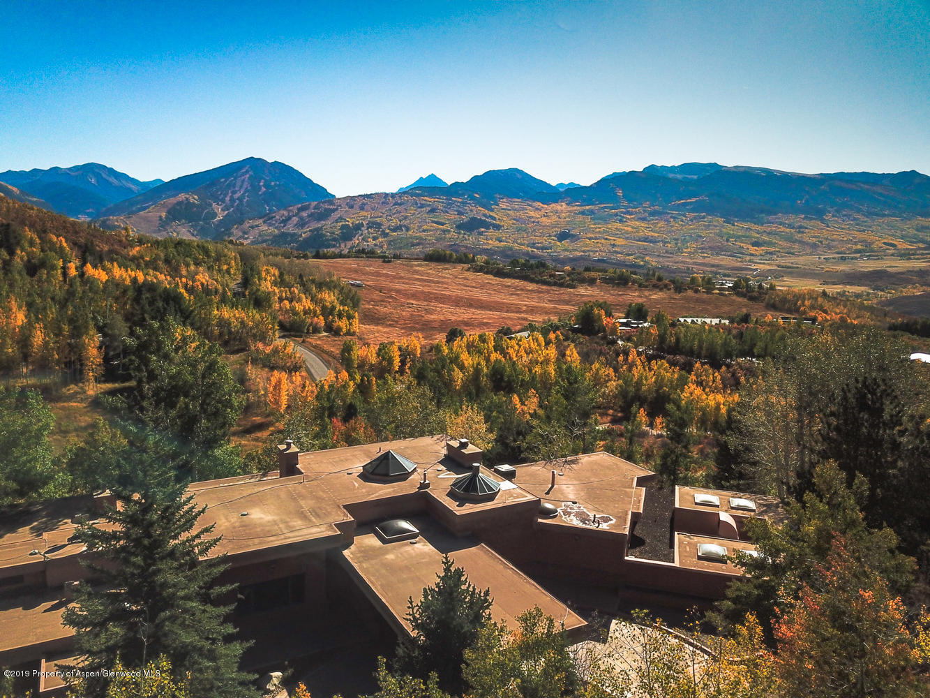 401 Carroll Drive Aspen, CO 81611 - Photo 1 of 10 a view of a mountain with a lake