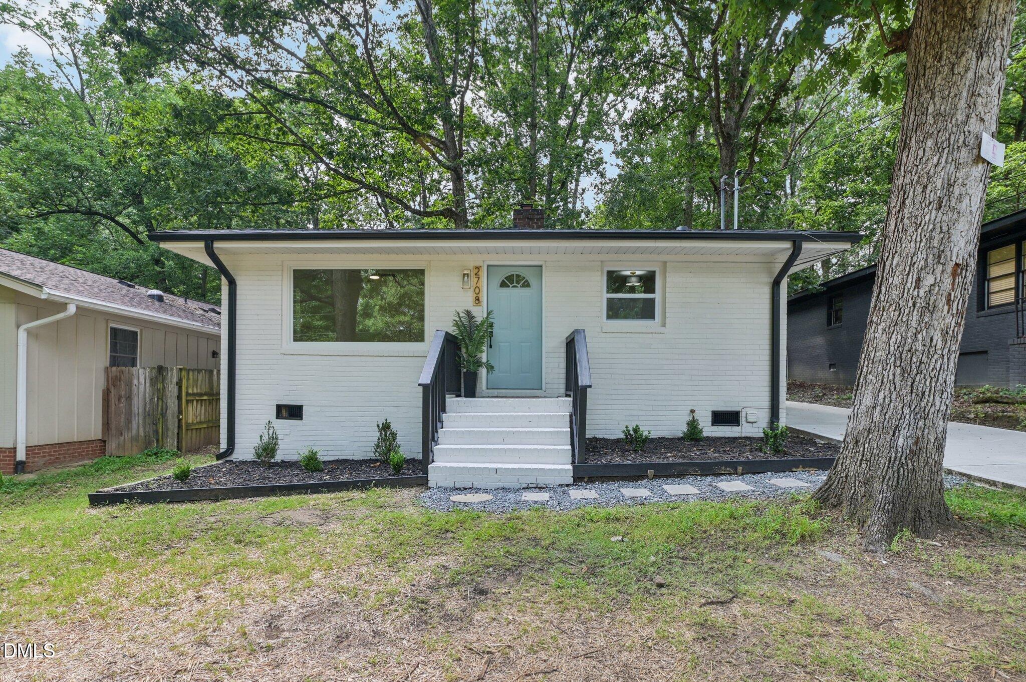2708 Sarah Avenue Durham, NC 27707 - Photo 1 of 31 a view of a house with backyard and garden