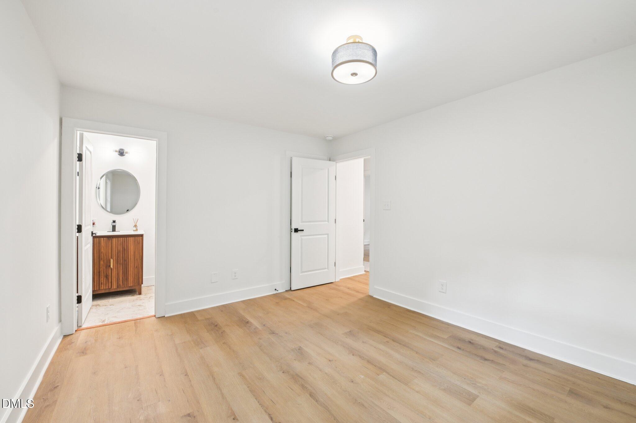 2708 Sarah Avenue Durham, NC 27707 - Photo 14 of 31 a view of a storage & utility room with wooden floor