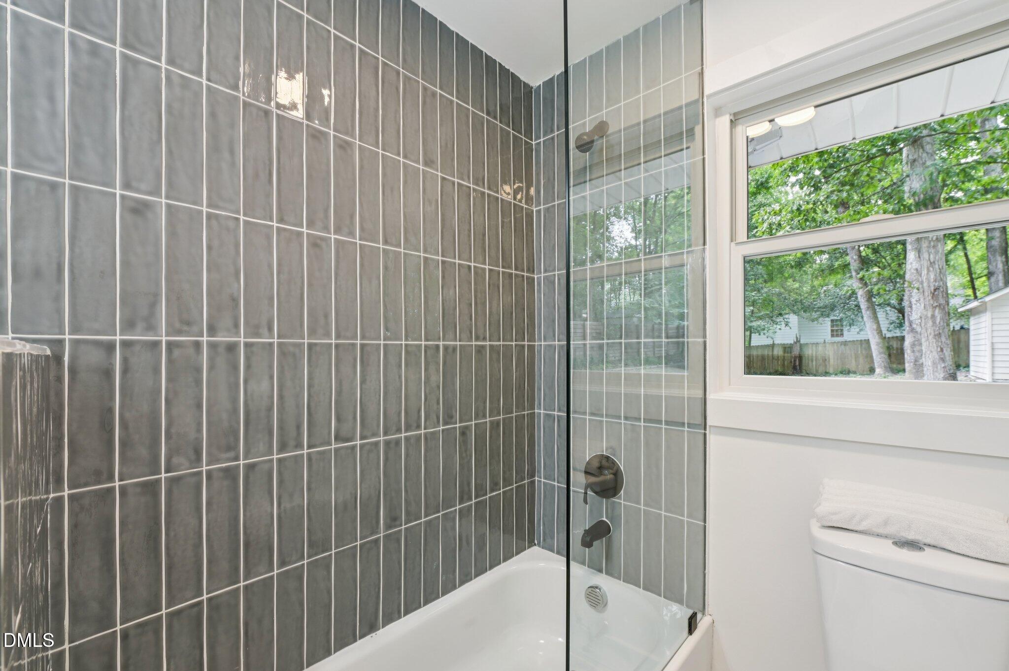 2708 Sarah Avenue Durham, NC 27707 - Photo 24 of 31 a bathroom with a shower and a sink