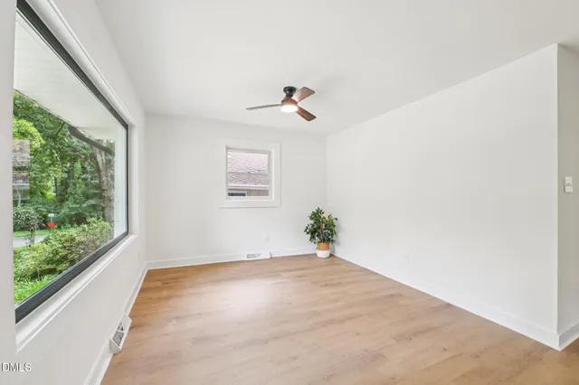 a view of an empty room with a window