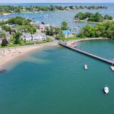 an aerial view of a house with a lake view