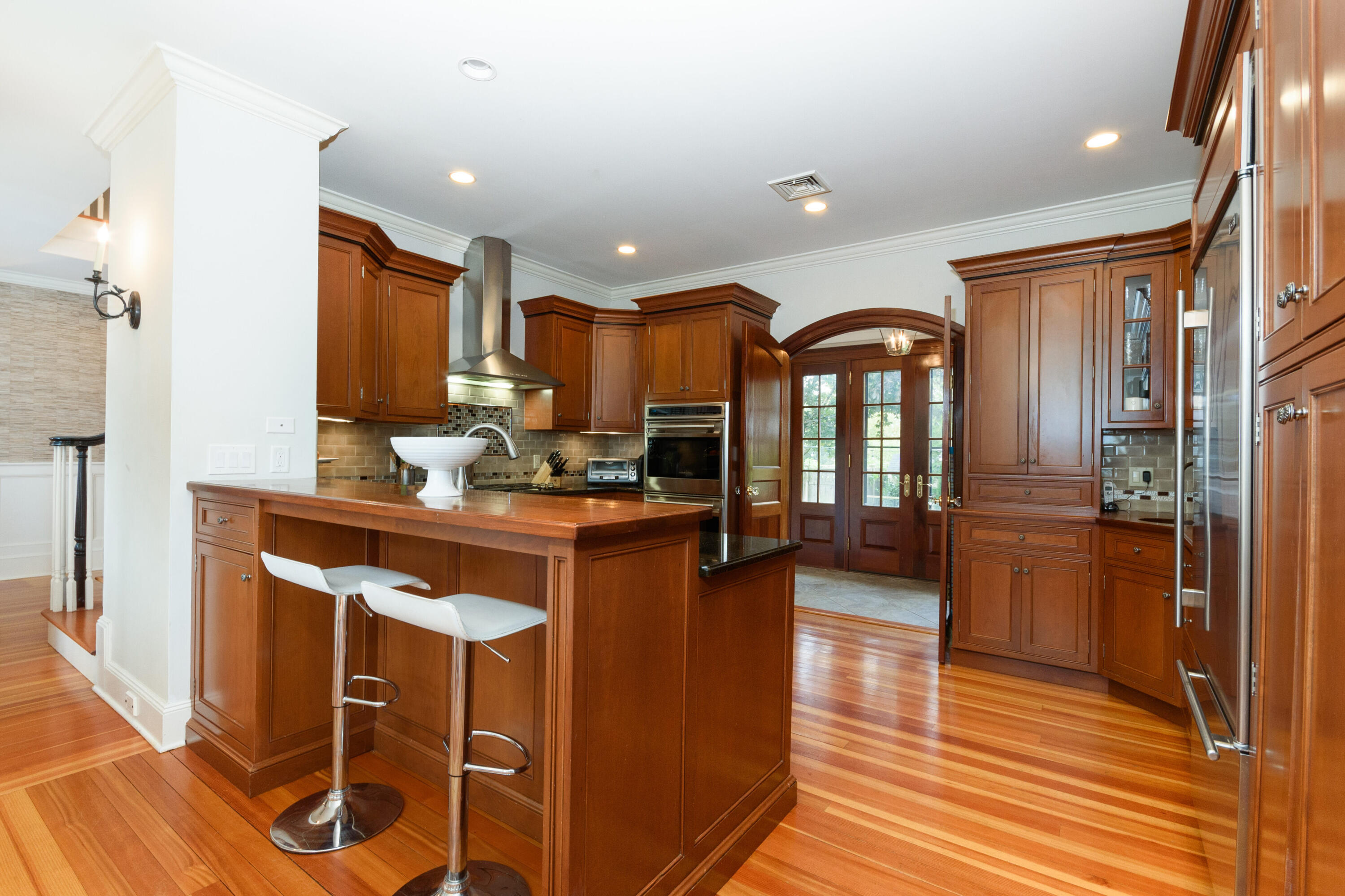 10 Mayflower Road Darien, CT 06820 - Photo 11 of 38 a kitchen with stainless steel appliances granite countertop a refrigerator a stove top oven a sink and cabinets