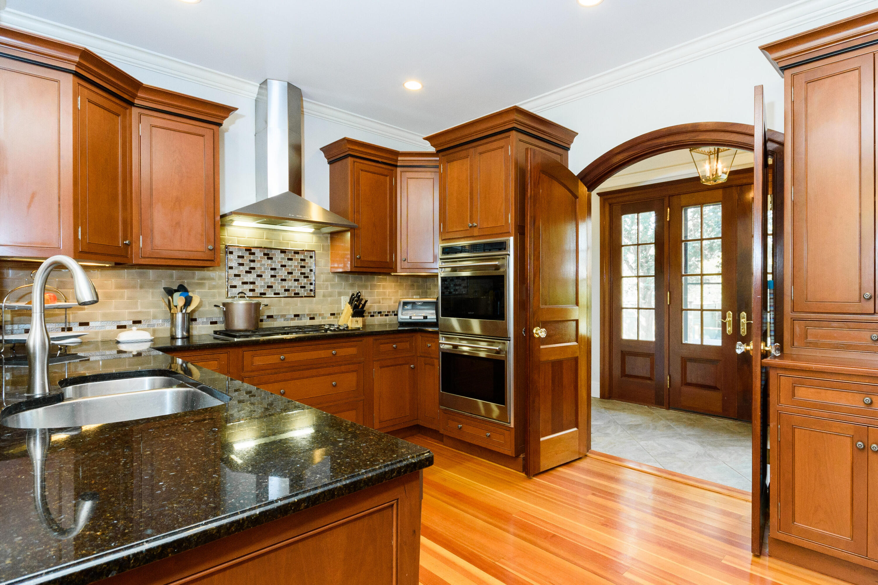 10 Mayflower Road Darien, CT 06820 - Photo 12 of 38 a kitchen with stainless steel appliances granite countertop a refrigerator and a stove
